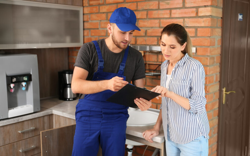Plumber taking feedback from client after job.