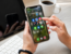 Person using a smartphone with social media apps for eCommerce marketing campaigns