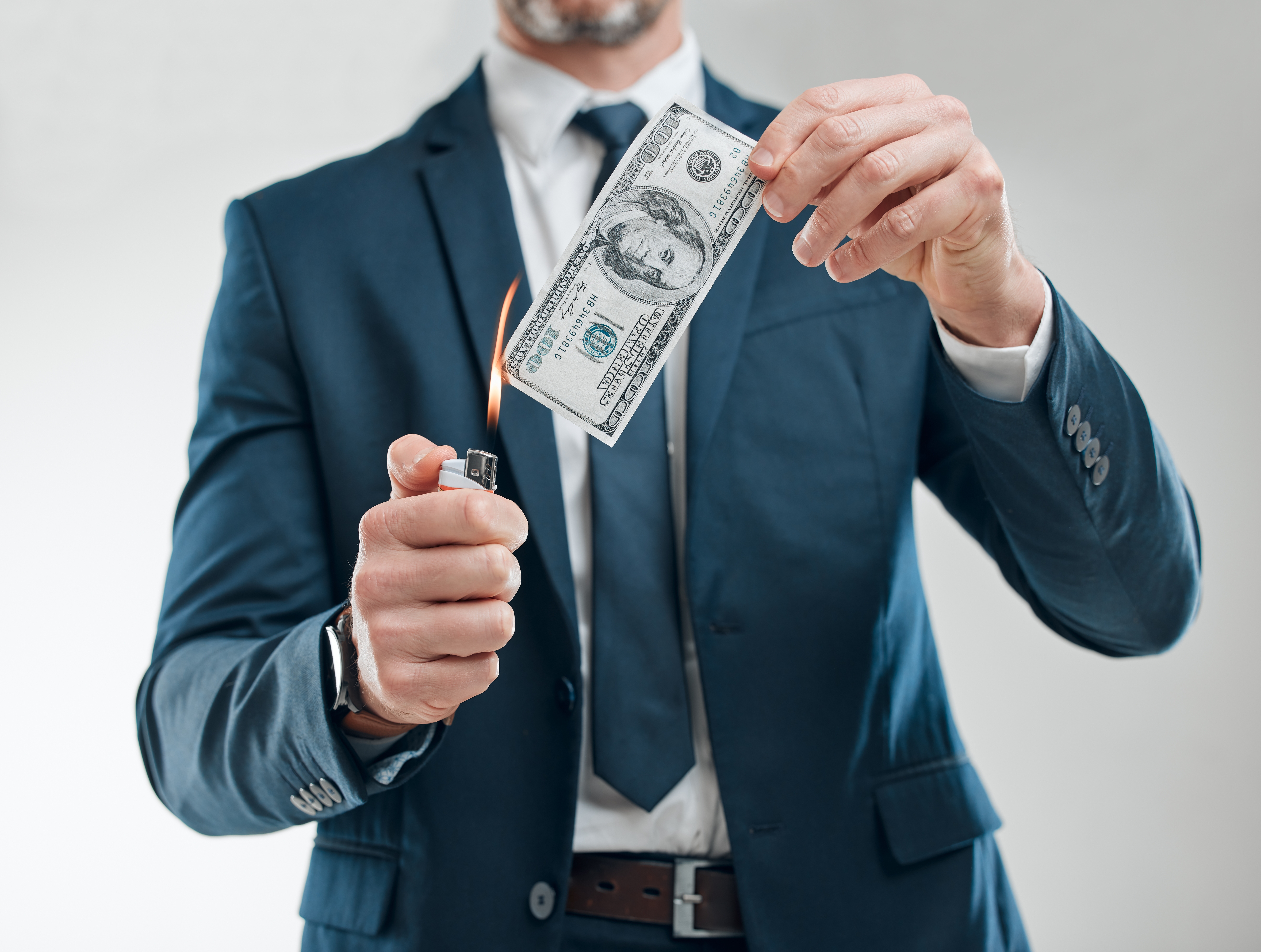 Business,,Man,And,Burning,Money on advertiising